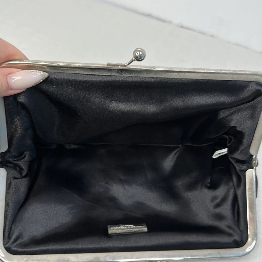 Carolina Herrera kiss lock black and silver clutch